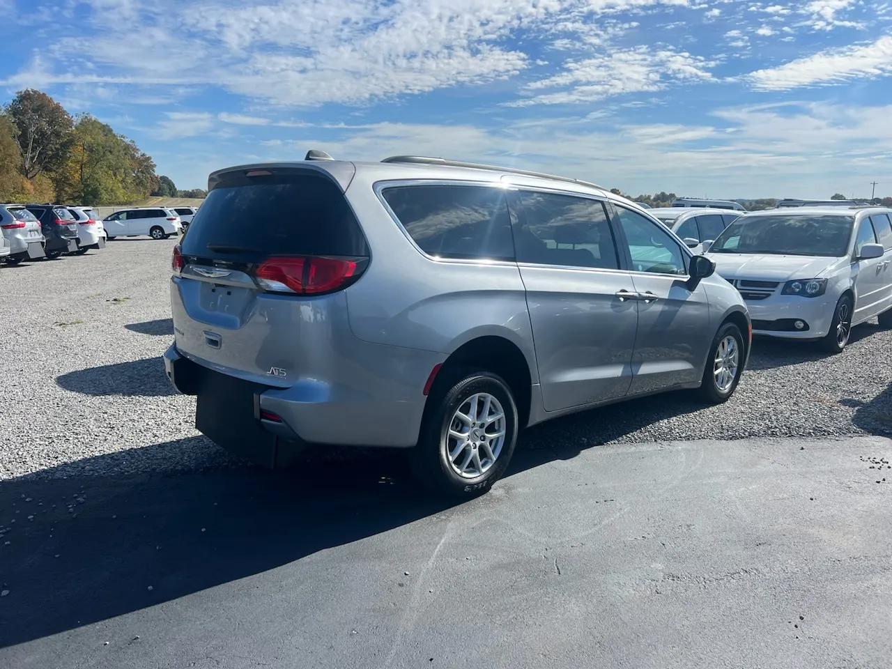 A silver Naeli wheelchair-accessible minivan