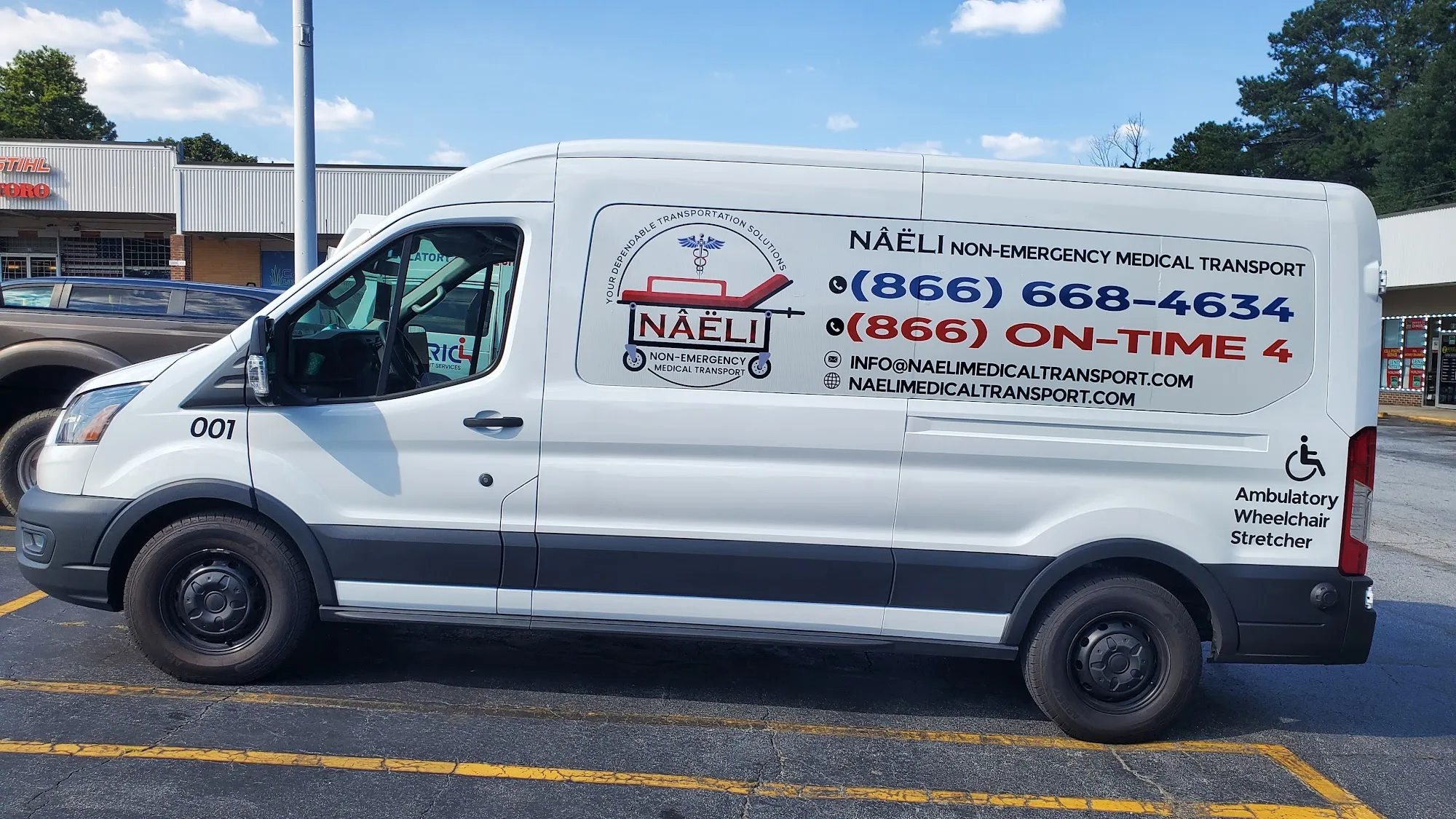 A white Naeli Non-Emergency Medical Transport van parked outside